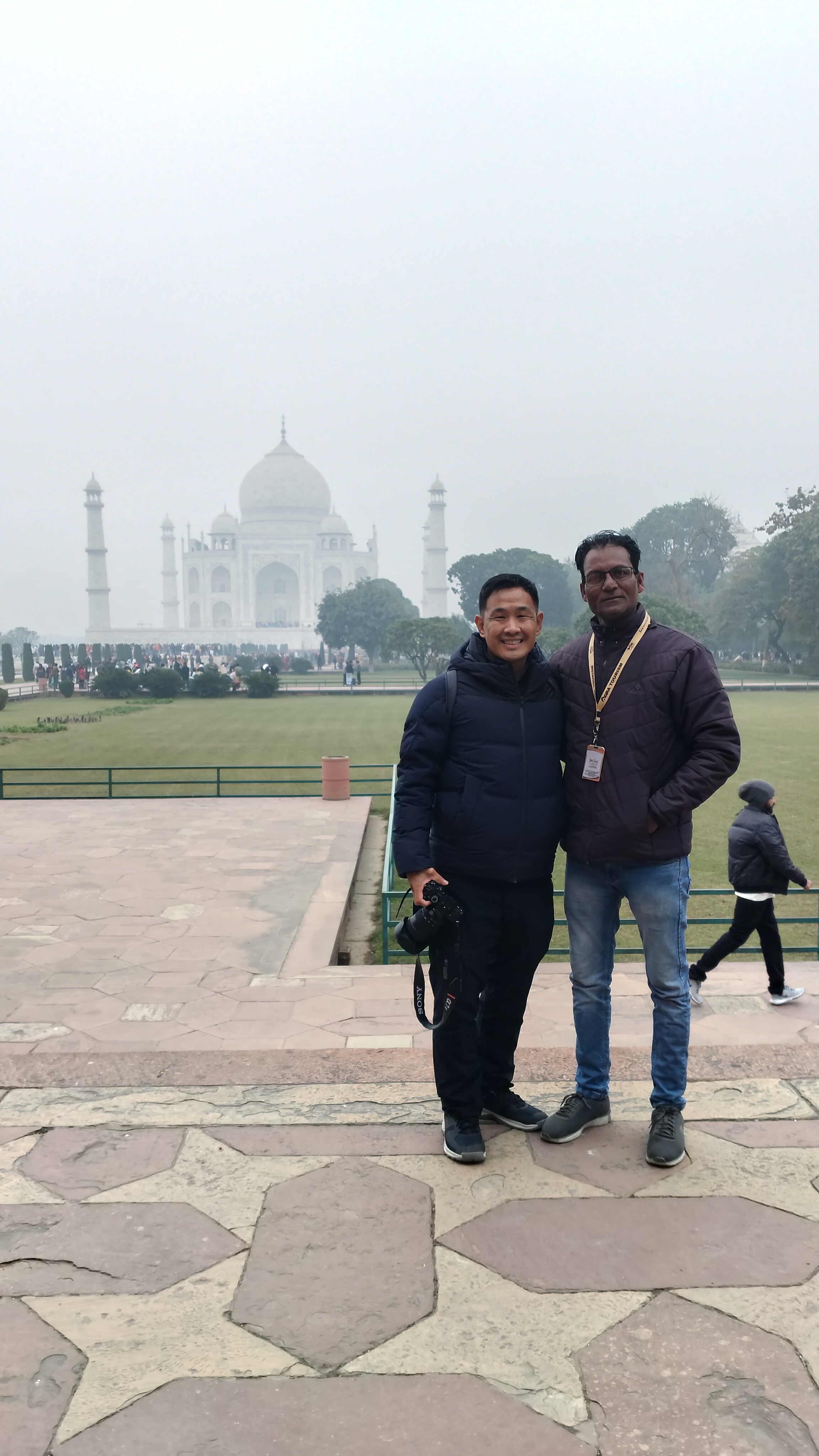 Mr. Verma with tourists smiling